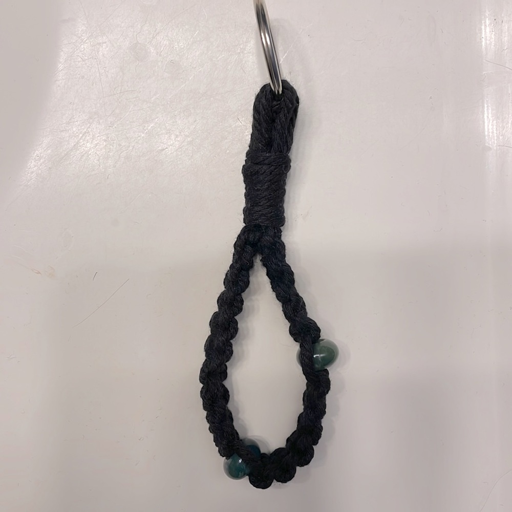 Handmade black macramé keychain